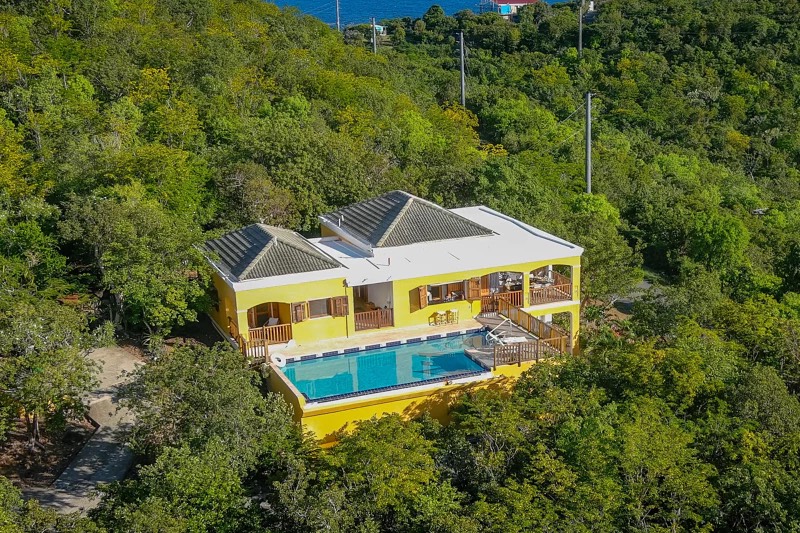 Yellow house with pool in greenery st thomas wedding venue